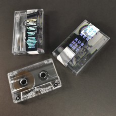 Clear prison cassette tapes in cases with J-cards and holographic foil obi strips