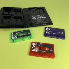 Transparent blue, green and red cassette shells with sticker printing in black triple rave case