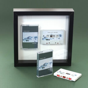 Audio cassette square presentation frame with grey stickered cassette shell and printed cassette case