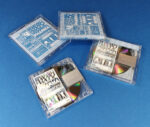 White on-body printing on the MiniDiscs, packed in clear cases with printed inserts